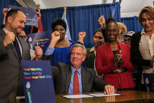 NYC Mayor Bill de Blasio signs Gender X bill at SAGE, flanked by Corey Johnson, Chirlane McCray, and transgender older New Yorkers.